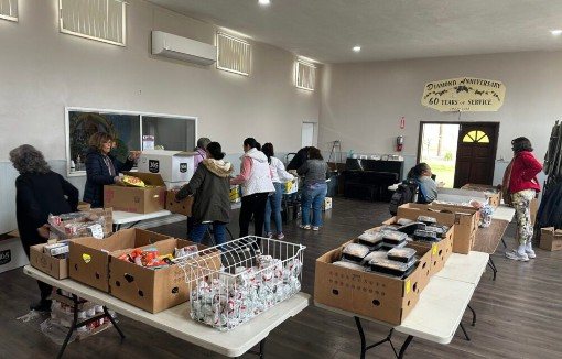 Packing food boxes in the Fellowship Hall